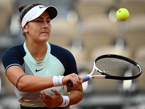 Canada's Bianca Andreescu returns the ball to Switzerland's Belinda Bencic during their women's singles match on day four of the Roland-Garros Open tennis tournament at the Court Philippe-Chatrier in Paris on May 25, 2022.
