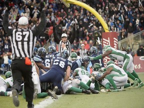 Toronto Argonauts quarterback Cody Fajardo lunges over the goal line to score the winning touchdown against the Saskatchewan Roughriders in the CFL's 2017 East Division final. Fajardo has been the Roughriders' starting quarterback since 2019.