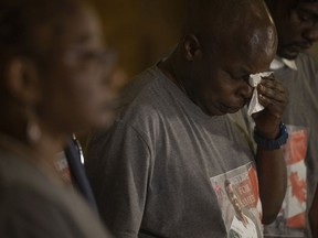 Taban Daudau Uko, father of Samwel Uko, stands beside his family at a press conference held during a coroner's in the death of 20-year-old Samwel Uko. He was found dead in Wascana Lake on May 21, 2020 having previously sought care twice at the Regina General Hospital before being escorted out by security.