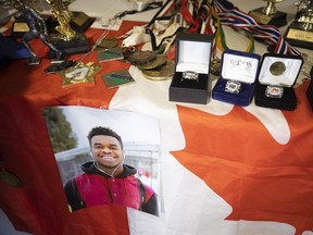 Various trophies and accolades attributed to Samwel Uko, sits on a table in front of his family at a press conference held during a coroner's in the death of 20-year-old Samwel Uko. He was found dead in Wascana Lake on May 21, 2020 having previously sought care twice at the Regina General Hospital before being escorted out by security.
