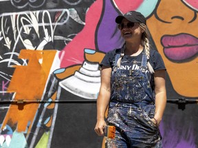 Artist Carly Jaye Smith is working on the first piece of street art going up as part of a the mural project, highlighting Regina entrepreneurship.