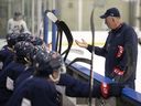 Regina Pats head coach and general manager John Paddock, shown running a practice in November, expects to return behind the bench next season after a battle with COVID-19.