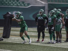 Saskatchewan Roughriders defensive end Pete Robertson, shown on the left during practice earlier this week, had a league-high five sacks entering Week 4 of the 2022 CFL season.