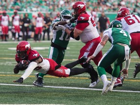 Ka'Deem Carey of the Calgary Stampeders dives for a touchdown against the Saskatchewan Roughriders on July 6, 2019. Calgary won 37-10. The Roughriders rebounded by winning their next six games en route to finishing first in the CFL's West Division.