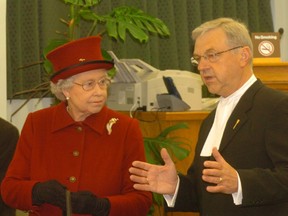 A file photo of former Speaker Myron Kowalsky giving Her Majesty Queen Elizabeth II a tour of committee room at the Saskatchewan legislature.