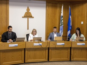 Regina Catholic Schools chief financial officer Josh Kramer, from left, board chair Vicky Bonnell, education director Sean Chase and deputy chair Shauna Weninger take part in a final budget meeting held at the Catholic Education Centre on Wednesday, June.