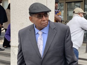Sylvester Ukabam, 76, stands in front of Court of Queen's Bench in Regina on Wednesday, May 18, 2022, following the conclusion of his trial. The Crown has appealed the judge's decision to acquit the former Regina doctor of seven counts of sexual assault.