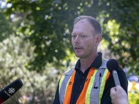 Ryan Johnston, supervisor of pest control for the City of Regina, speaks before crews took down a tree with Dutch elm disease in Victoria Park on Friday, July 15, 2022.