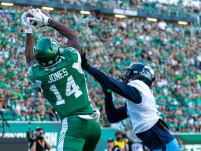 Saskatchewan Roughriders receiver Tevin Jones (14) catches the football for a touchdown during second quarter of CFL football action against Toronto Argonauts on Sunday.