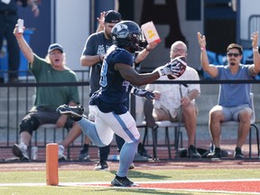 The Toronto Argonauts' Wynton McManis crosses the goal line on what proved to be a game-winning interception-return touchdown Saturday against the Saskatchewan Roughriders in Wolfville, N.S.