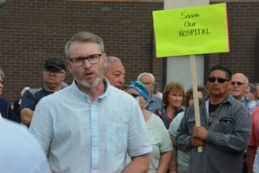 Rural and Remote Health Minister Everett Hindley speaks with people outside the Kamsack Hospital following rallies on Thursday protesting service reductions.
