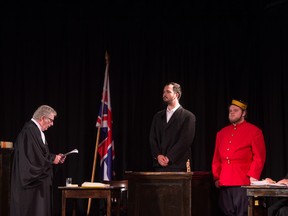 From left, Bill Swerid, playing court clerk, Nicholas Boudreau, playing Louis Riel, Philip Ring, playing Corporal Joseph Piggott and Michael Koops, playing F. X. Lemieux during a performance of the Trial of Louis Riel held at the Saskatchewan Express Studio on Aug. 7, 2019.