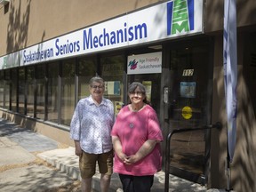 Holly Schick, right, and Linda Anderson stand for a portrait outside the Saskatchewan Seniors Mechanism office in June.