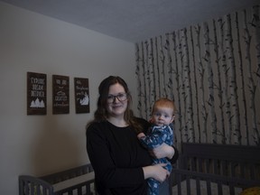 Emery Wagner and her five-month-old Ellie Wagner stand for a portrait in their home on Monday, February 14, 2022 in Regina.