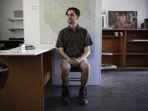 Prairie Heart Maps cartographer Alex McPhee in his office on July 19, 2022 in Val Marie.