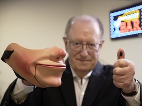 Doug Arden's ventriloquist act includes a custom mask worn by an audience volunteer.  The mouth opens and closes using a thumb-operated device, allowing the volunteer to 'say' what they want.