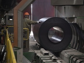 In this file photo from March 2019, a worker marks a coil of steel at Evraz in Regina.