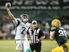 Saskatchewan Roughriders quarterback Cody Fajardo throws the ball under pressure from Edmonton Elks linebacker Adam Konar on Saturday at Commonwealth Stadium.