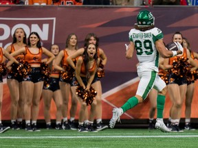 Saskatchewan Roughriders slotback Kian Schaffer-Baker (89) runs past the B.C. Lions cheerleaders on his way to scoring a touchdown in the first half at BC Place. on Friday.
