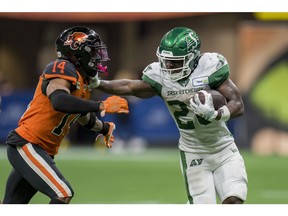 Saskatchewan's Frankie Hickson (20) rushed for 129 yards in the Riders' 23-16 win over Marcus Sayles (14) and the Lions on Friday.