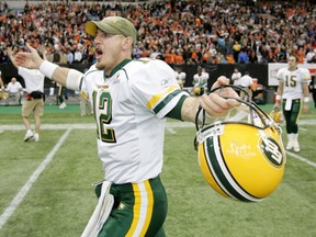 Jason Maas — now the Saskatchewan Roughriders' offensive co-ordinator — celebrates as fellow Edmonton quarterback Ricky Ray walks behind him after a 28-23 victory over the host B.C. Lions in the CFL's 2005 West Division final. Edmonton went on to win the Grey Cup that season.