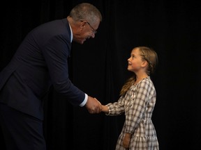 Lieutenant Governor Russ Mirasty gives the Jubilee Medal to Mady Adamson of Kindersley during the presentation of the Queen Elizabeth II Platinum Jubilee Medal to its recipients at the Regency Ballroom in the Hotel Saskatchewan on Tuesday, August 30, 2022 in Regina.