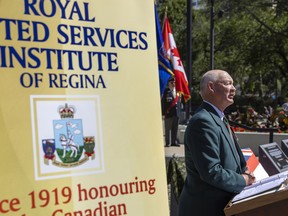 Maj. (retd) Brad Hrycyna speaks during the unveiling of two new plaques in Victoria Park near the cenotaph commemorating Canadian war efforts on Aug. 8, 2022 in Regina.