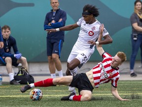 Toronto FC II's Reshaun Walkes, top, and Sunderland AFC's Oliver Bainbridge are shown during Wednesday's international under-23 soccer friendly at Mosaic Stadium.