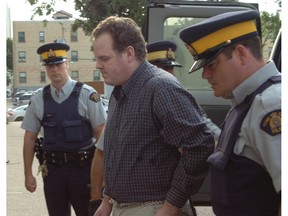 Peter Whitmore enters Regina’s Court of Queen’s Bench while in custody.