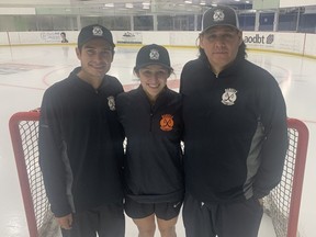 Sydney Daniels (centre) stands with her father, former NHLer Scott Daniels (left) and cousin Colby Daniels.