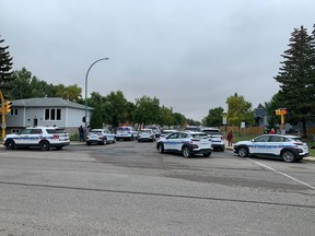 More than a dozen Regina police vehicles are on scene for a lockdown at F.W. Johnson Collegiate on Sept. 23, 2022.