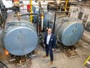 Kevin Saunderson, executive director service innovation, stands by the boilers at the Regina Public Library Central Branch  on Thursday, September 22, 2022 in Regina.