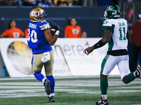 Winnipeg Blue Bombers’ Nic Demski gets behind Saskatchewan Roughriders linebacker Larry Dean for a TD pass Friday night at IG Field.