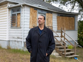 Murray Giesbrecht, executive director of the North Central Community Association, stands in from some houses in poor condition in North Central on Tuesday, September 20, 2022 in Regina.