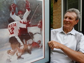 Paul Henderson is shown with a portrait of his game-winning goal in the 1972 Summit Series between Canada and Russia.