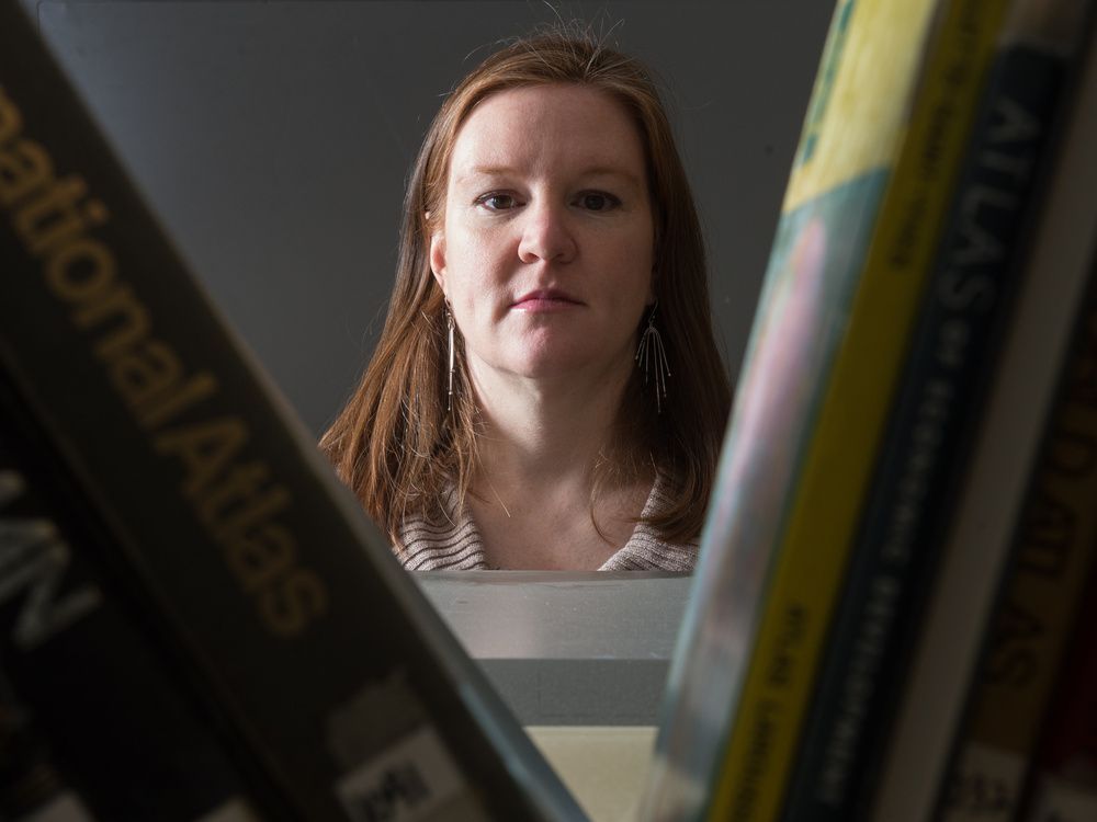  emily eaton, a professor in the department of geography and environmental studies at the u of r, stands in the map library in the university’s classroom building on jan. 24, 2019.