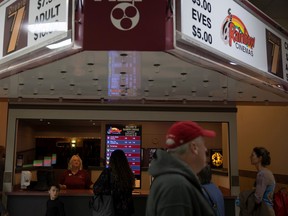 Ticket operator Tammy Osborne ushers through the final crowd of attendees during the final evening of the Rainbow Cinemas Theatre before is closes its doors for good on Sunday, September 25, 2022 in Regina. The Rainbow Cinemas theatre, which is known for its cheaper fairs, first opened its doors in 1998.