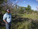 Doug Wilson stands in a dried up portion of the Maple Creek near his ranch.