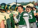 Huskies' quarterback Mason Nyhus shakes hands with Regina Rams players after an Oct. 15 game.