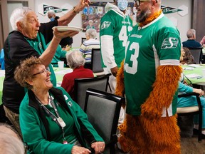 During ‘Green Week’ celebrations this spring, residents and staff welcomed Saskatchewan Roughrider linebacker Derrick Moncrief to Harbour Landing Village for a special meet-and-greet. Janson Anderson, president and CEO of Harbour Landing Village, added to the fun by dressing up as ‘Faux Gainer’ and taking a pie in the face from Harbour Landing Village resident Jim Nedelcov. SUPPLIED