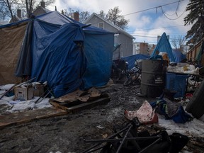Tarps, tents and other collected items sit on an empty property where a makeshift camp on Halifax street has been set up for those experiencing homelessness on Tuesday, October 25, 2022 in Regina.