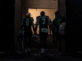 Saskatchewan Roughriders quarterback Mason Fine (8) and quarterback Cody Fajardo (7) walk into the tunnel following CFL football action against the Calgary Stampeders in Regina on Saturday, October 22, 2022.
