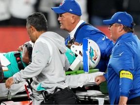 Dolphins quarterback Tua Tagovailoa is taken off the field after suffering a head injury following a sack by Bengals defensive tackle Josh Tupou (not pictured) in the second quarter at Paycor Stadium in Cincinnati, Thursday, Sept. 29, 2022.