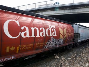 A Canadian Pacific Rail train hauling grain passes through Calgary
