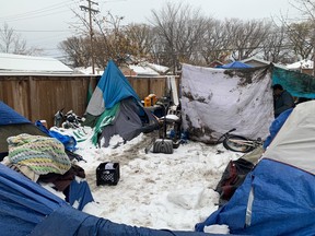 A small tent city has popped up behind Carmichael Outreach in Regina as more people face houselessness in the city.