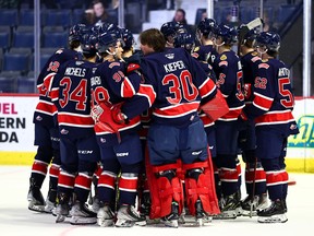 The Regina Pats celebrate Saturday's 4-3 victory over the Swift Current Broncos at the Brandt Centre.