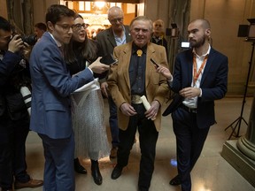 Former Saskatchewan politician Colin Thatcher, who was convicted for the murder of his ex-wife, JoAnn Wilson, speaks to the media after exiting the house chambers after the Throne Speech inside the Saskatchewan Legislative Building on Wednesday, Oct. 26, 2022 in Regina.