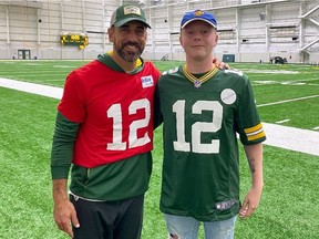 Green Bay Packers quarterback Aaron Rodgers with Regina's Luke Schofield on Sept. 30 at the NFL team's practice facility.