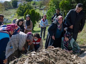 A woman reacts during a Selcuk Ayvaz funeral ceremony of miners who died after an explosion in a coal mine in Amasra, in Bartin Province, Turkey, on Oct. 15, 2022.