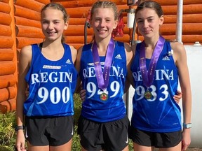 Three Regina athletes are shown after Saturday's intermediate girls race at the Saskatchewan High Schools Athletic Association cross-country championships. Left to right: Hampton Lebell of Sheldon-Williams (who finished eighth), Sofia Ouellet of Laval (bronze medal) and Hannah Gates of Sheldon (silver).